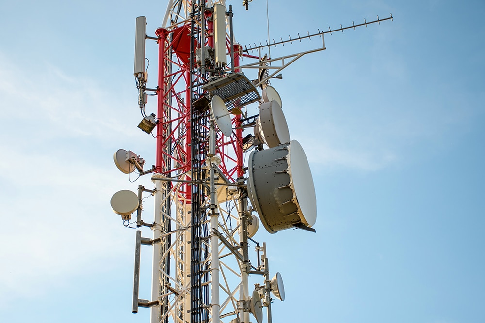 low-angle-view-of-antenna-tower-against-a-blue-sky-2023-11-27-04-57-26-utc